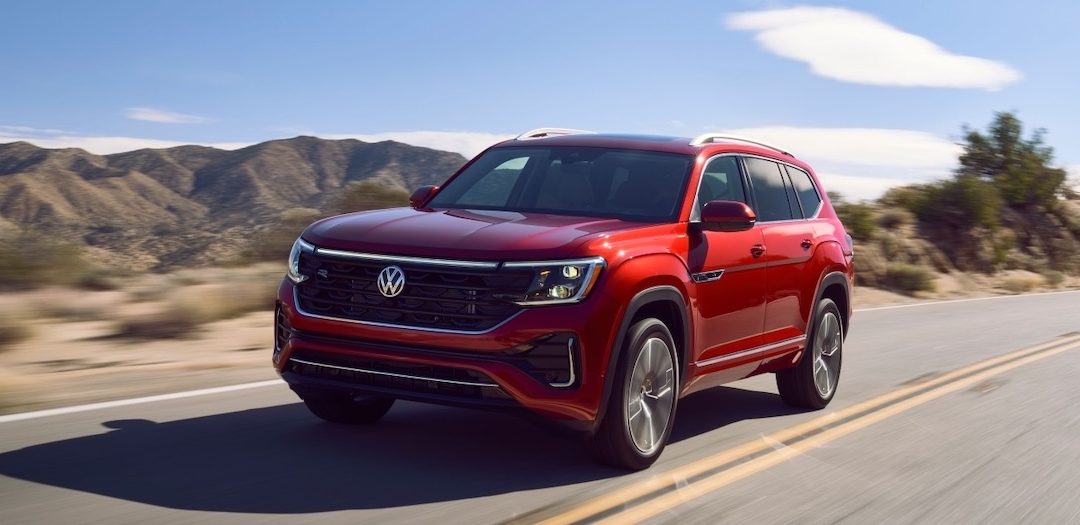 Red 2026 Volkswagen Atlas driving on the road for a blog about common causes of flat VW tires near Snellville, GA